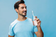© SHOTPRIME STUDIO - Happy man water healthy portrait bottle attractive smile studio sport lifestyle t-shirt drink