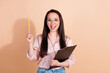 © deagreez - Photo of attractive genius girl wear pink shirt in glasses hold checklist raising pencil up have idea isolated on pastel color background