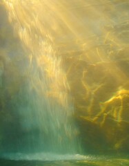 Wall Mural -  Blurred background with opalizing misty pale wall of flowing waterfall. 