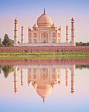 Fototapeta Miasto - Taj Mahal famous marble mausoleum at sunset, on the south bank of the Yamuna river in the Indian city of Agra, India