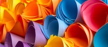 A Colorful Stack Of Paper Rolls With Plant, Petal, Orange, Yellow, Electric Blue Pattern, Creating An Artful Close-up. This Vibrant Display Is Perfect For An Event, Offering A Burst Of Peach Hues.