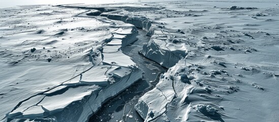 Wall Mural - Melting glacier caused fractures in shelf ice on open water.
