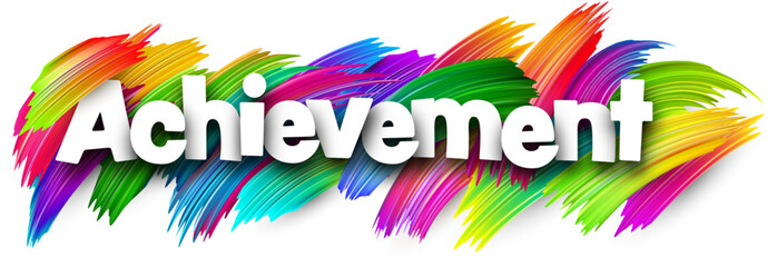 Achievement paper word sign with colorful spectrum paint brush strokes over white.