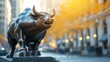 Bronze bull statue in city at sunset