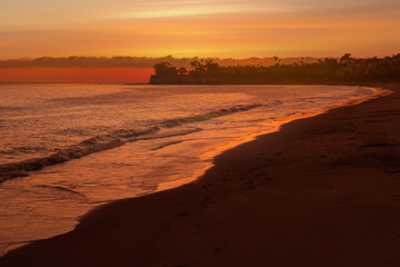 Wall Mural - A Colorful Ocean Sunset Sky as a Gentle Wave Rolls in Santa Barbara Harbor Marina Ships Bay California,