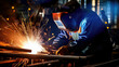 © David - close up of skilled welded working at engineers bench,  surrounded by sparks and industrial workshop
