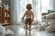 Rear view of a toddler carrying tissues and making a mess. A toddler playing with tissue. Baby making mess with tissue paper