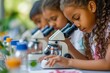 Diverse female students use microscopes in science class, focused on experiment, colorful samples, educational discovery, concentration visible. Girls in science education, engaging with microscopes