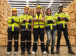 © Jack Tamrong - Photo group of diversity men and women workers standing arm crossed making unity in wood distribution factory