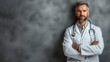 © AnastasiiaCherkas - Portrait of professional medical doctor in workwear with stethoscope on neck in grey background