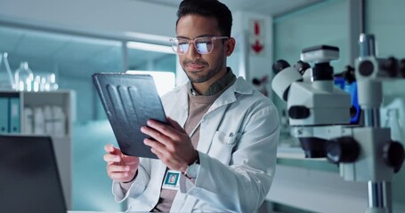 Tablet, scientist and reading for internet in laboratory, healthcare and online for medical research. Asian expert, glasses and connection on pharmaceutical app and working on innovation in medicine