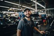 © Geber86 - Smiling young man working in a automotive factory