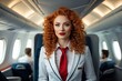 Close-up of a beautiful woman in a flight attendant uniform with bright fiery red hair