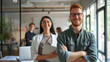 © Studio Nova - A man and a woman, both wearing glasses, are smiling and confidently standing in a modern office environment, the woman holding a tablet.