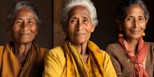 Three Elderly Women With Warm Smiles Wearing Traditional Attire