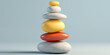 © Tata Che - A stack of stones of different colors, neatly stacked on top of each other. Visually appealing balance composition