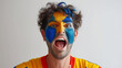 Australia flag face paint, Close-up of a person's face, symbolizing patriotism or sports fandom.