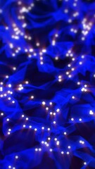 Wall Mural - blue color abstract particle foam field waving smoothly like fluid. waving triangles particles motio