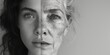 Artistic black and white contrast showing a woman's face aging from young to old