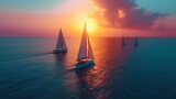 Aerial view of stunning sailboats sailing in perfect harmony on the serene blue sea