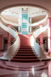 Photo realistic art deco building interior stairs where pink and white are the predominant colors