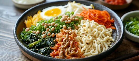 Wall Mural - A delicious dish of rice noodles and vegetables served on a wooden table, perfect for a quick and satisfying meal.