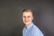 © travelview - portrait of smiling teenage boy isolated on black