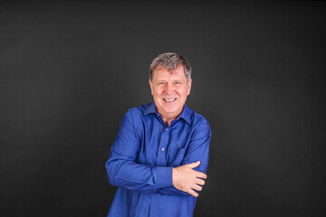 portrait of smiling man isolated on black