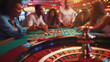 A group of people sitting around a roulette table, with their eyes glued to the wheel, each with different expressions of excitement, anticipation, and nervousness.