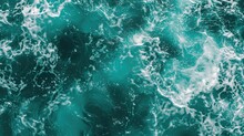 Turbulent Seafoam Green Waters Churn Vigorously, Showcasing The Dynamic Power Of The Ocean