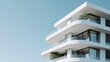© Tati - Minimalist white modern architecture with sweeping balconies and clean lines against a clear sky