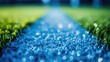 Close-up of artificial turf with dew droplets