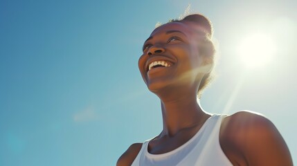 Fitness, black woman and happy athlete smile after running, exercise and marathon training workout. Blue sky, summer sports and run of a African runner breathing with happiness from sport outdoor