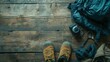 Outdoor hiking gear is neatly arranged on a wooden surface, with copy space