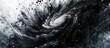 © AkuAku - A monochrome photograph captures the captivating sight of a hurricane swirling in the vast expanse of the ocean.