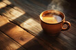 © Gun - A coffee cup placed on a wooden table and the morning sunlight shining on it create a beautiful blend of shadows in the morning.