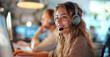 Smiling female customer support operator with headset working in a call center.