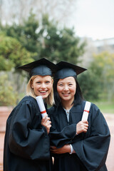 Wall Mural - Graduation, campus or portrait of friends with education, future goal or studying for opportunity. Women, smile or happy college graduate with success, certified achievement or university scholarship