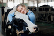 © Parilov - Happy young woman farm worker hugging cow as sign of concern for animal health care. Concept agriculture cattle livestock farming industry
