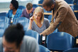 © Nicola K/peopleimages.com - University, helping and professor with student in classroom studying for test, exam or assignment. Education, learning and teacher talking and explaining college information to woman in lecture hall.