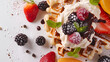 © MONWARA - Beautiful and delicious snacks - waffles adorned with luscious cream and a variety of fruits isolated on a white background