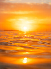 Wall Mural - water surface with golden sunlight reflection.