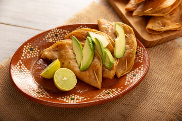 Wall Mural - Pescadillas. So called when they are stuffed with fish such as tuna, popular during the Lent season. They are known as Golden Quesadillas when they are filled with ingredients such as meat or potatoes