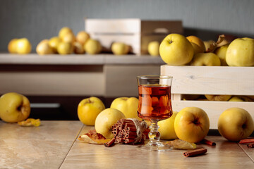 Wall Mural - Fresh juicy apples in in wooden box and glass of apple juice.