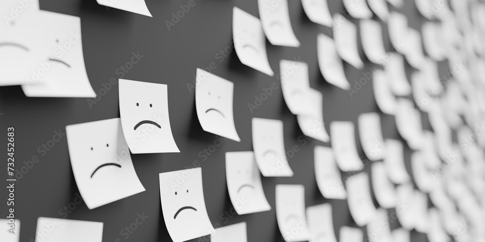 Many white stickers on black board background with sad smile symbol ...