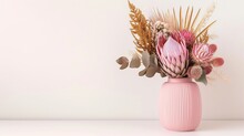 Gorgeous Pink Vase Filled With A Gorgeous Arrangement Of Dried Flowers, Featuring Pink King Proteas And Banksia Captured In An Image On White Background.