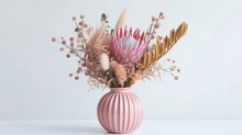 Gorgeous Pink Vase Filled With A Gorgeous Arrangement Of Dried Flowers, Featuring Pink King Proteas And Banksia Captured In An Image On White Background.