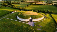 Aerial View Of An Artificial Concrete Mound In A Green Landscape At Golden Hour