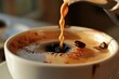 Coffee pouring into a cup, close-up, selective focus