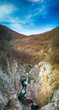 © Krasimir - Panoramic view of Blue Sini vir waterfall at Medven, near Kotel, Bulgaria. Spring green view of a beautiful waterfall among cliffs. Emerald lake and blue sky. Panorama - Image